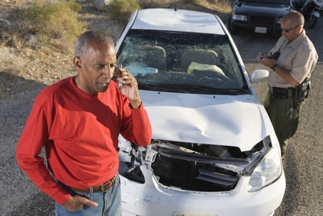 man on the phone after being in a car accident